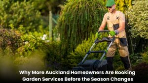 A professional gardener maintaining a clean and healthy residential garden in Auckland before the seasonal weather change.