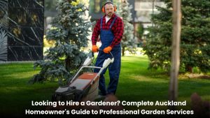 Professional gardener maintaining a beautiful residential garden in Auckland with trimmed hedges, lush lawns, and healthy plants.