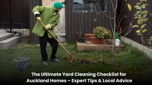 Homeowner cleaning a backyard lawn and garden in Auckland with trimmed hedges, leaf removal, and a tidy outdoor space.